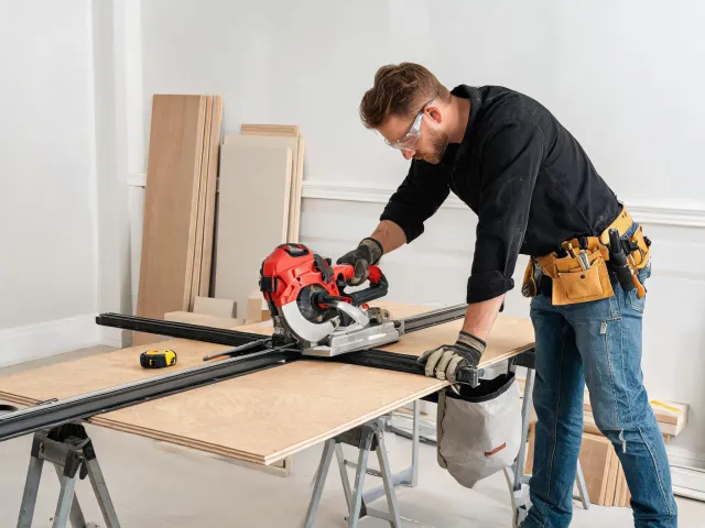 Finish carpentry using a guided saw